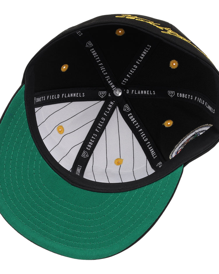 The Roberto Clemente EFF Signature Series Fitted Ballcap in black by EFF features a green under brim, white pinstripe lining, and yellow stitching, with “EBBETS FIELD FLANNELS” branding—classic style from above.