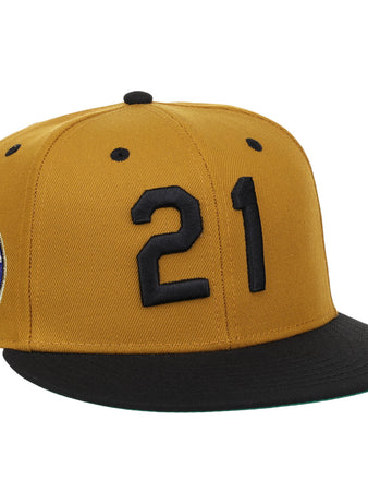 The EFF Roberto Clemente Signature Series Fitted Ballcap in gold features black number 21 on the front, a colorful side patch, and a black brim—perfect for fans and collectors.