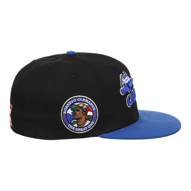 The EFF Santurce Cangrejeros Clemente Fitted Ballcap in black features a blue visor, side patch of Roberto Clemente with ROBERTO CLEMENTE THE GREAT ONE, and embroidered front and back designs.