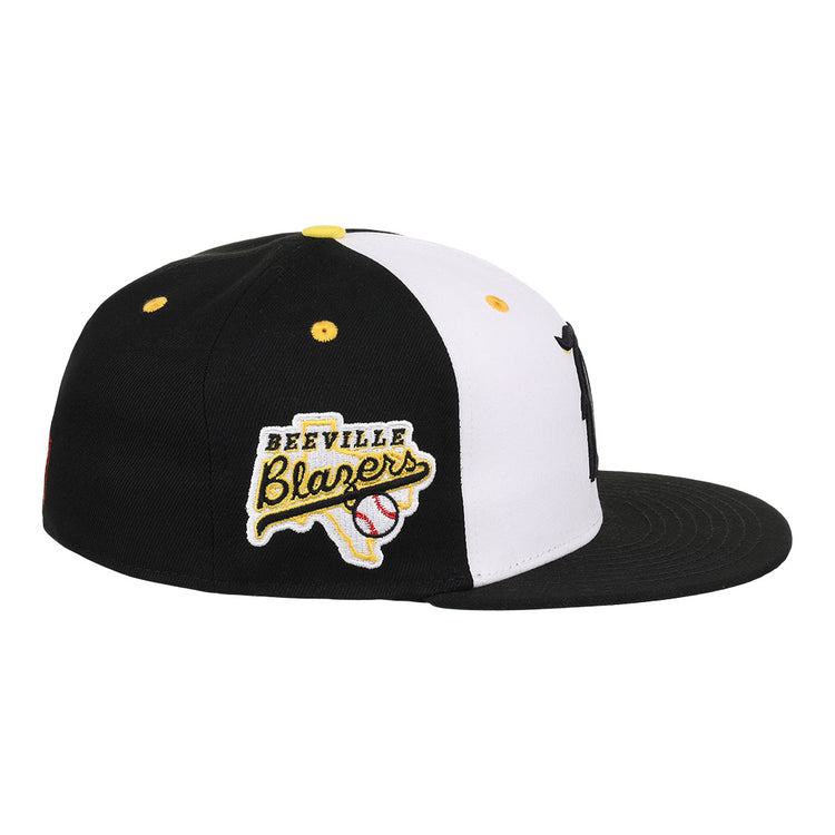 The Beeville Blazers EFF Lone Star Fitted Ballcap by EFF is a black and white flat-brim cap featuring an embroidered Beeville Blazers logo patch with a Texas outline and baseball graphic, representing the Lone Star League.