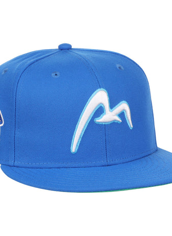 The EFF Corpus Christi Seagulls EFF Lone Star Fitted Ballcap is blue, with a white flying seagull on the front and a left-side patch reading Montgomery Biscuits Sea Gulls, inspired by the Lone Star League’s Corpus Christi Seagulls.