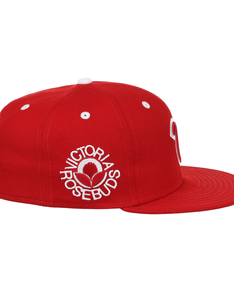 The EFF Victoria Rosebuds Lone Star Fitted Ballcap features a structured modern crown, red fabric, flat brim, crisp white stitching, and “VICTORIAS ROSEBUD” embroidered in white around a 3D rose logo on the side.
