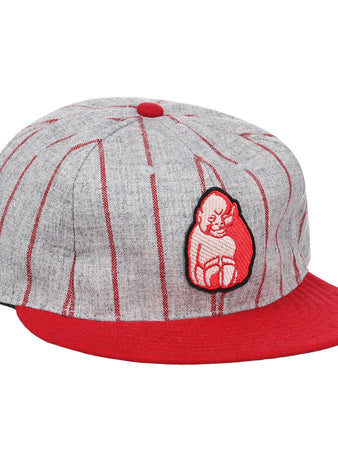 The Bilikens Cigarros 1921 Vintage Ballcap by Ebbets Field Flannels features thin red stripes, a red brim and button, plus a red-and-white cat patch inspired by classic Cuban Amateur League style.