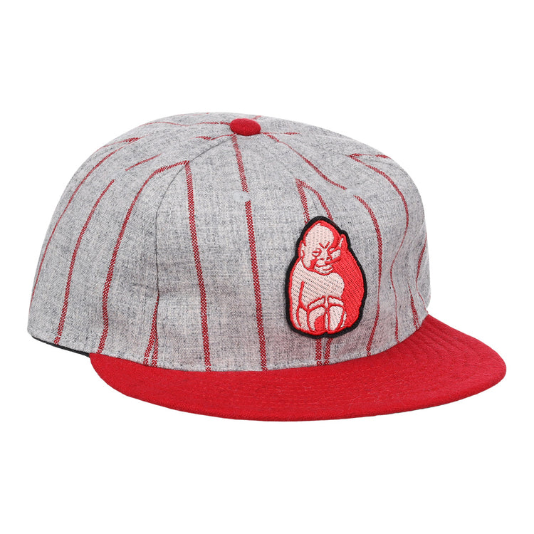 The Bilikens Cigarros 1921 Vintage Ballcap by Ebbets Field Flannels features thin red stripes, a red brim and button, plus a red-and-white cat patch inspired by classic Cuban Amateur League style.
