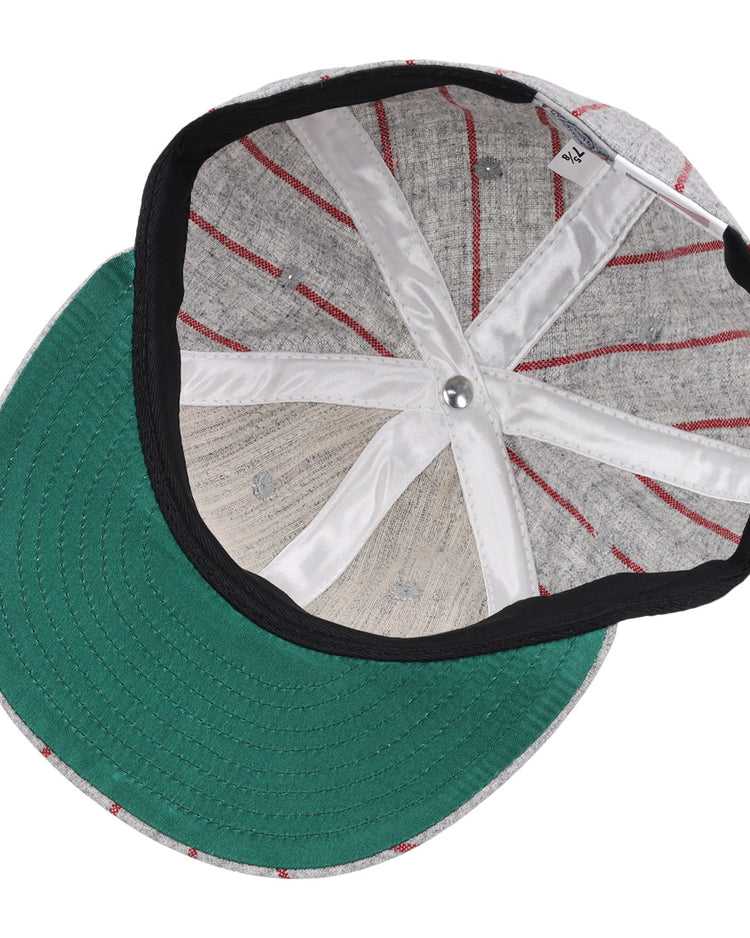 A top-down view of the Ebbets Field Flannels Cienfuegos Stars 1940 Vintage Ballcap shows gray fabric with red stitching, a green underbrim, and white satin lining—mirroring the classic Cuban Amateur League style.
