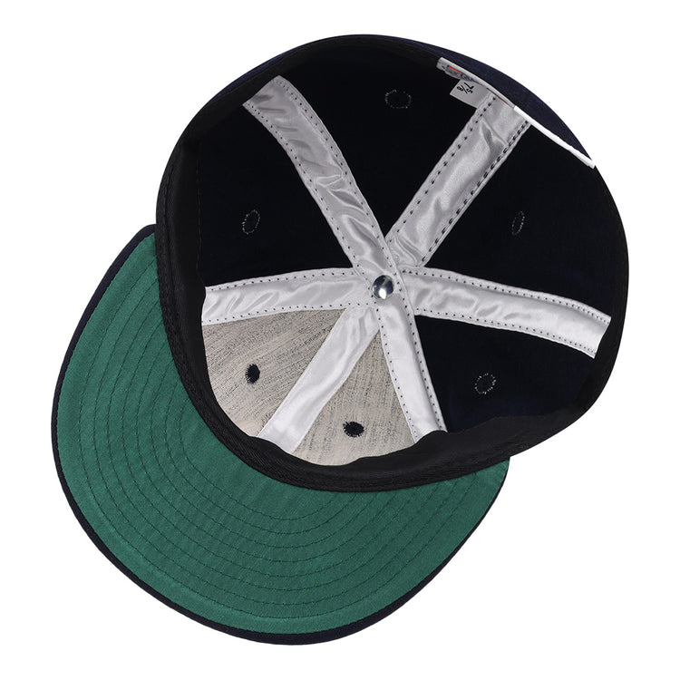 The image shows the inside of an Ebbets Field Flannels Vedado TC 1945 Vintage Ballcap with a green underside on the brim, white interior support bands, and dark navy panels—reminiscent of classic Cuban National Amateur League style.