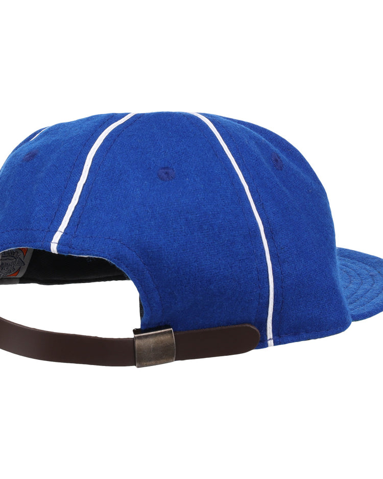The Almendares Alacranes 1931 Vintage Ballcap by Ebbets Field Flannels is a blue Cuban League cap with white stripes, seen from the back, and features an adjustable brown leather strap with metal buckle.