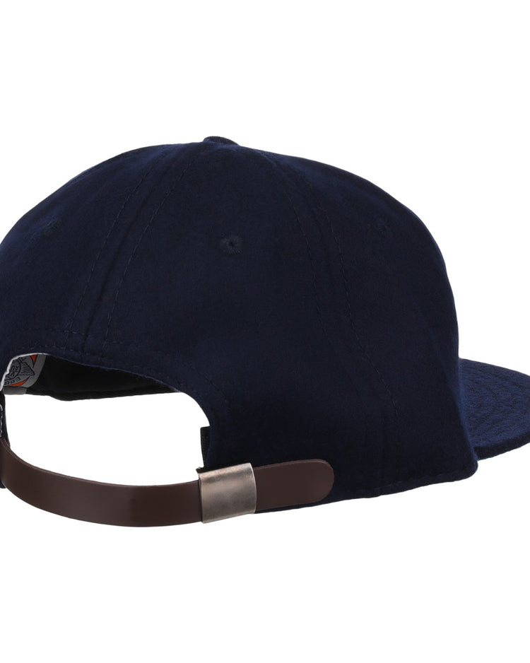 The Ebbets Field Flannels Vedado TC 1945 Vintage Ballcap in navy blue is shown from the back with a brown adjustable leather strap and metal clasp, displayed on a plain white background.