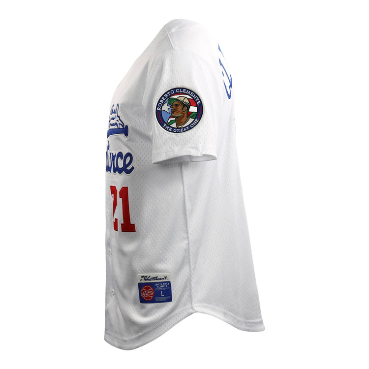 A side view of the EFF Roberto Clemente Santurce Cangrejeros Vintage Inspired NL Replica Button-Up Mesh Jersey, white with blue and red lettering, number 21, and a commemorative right sleeve patch, shown against a white background.