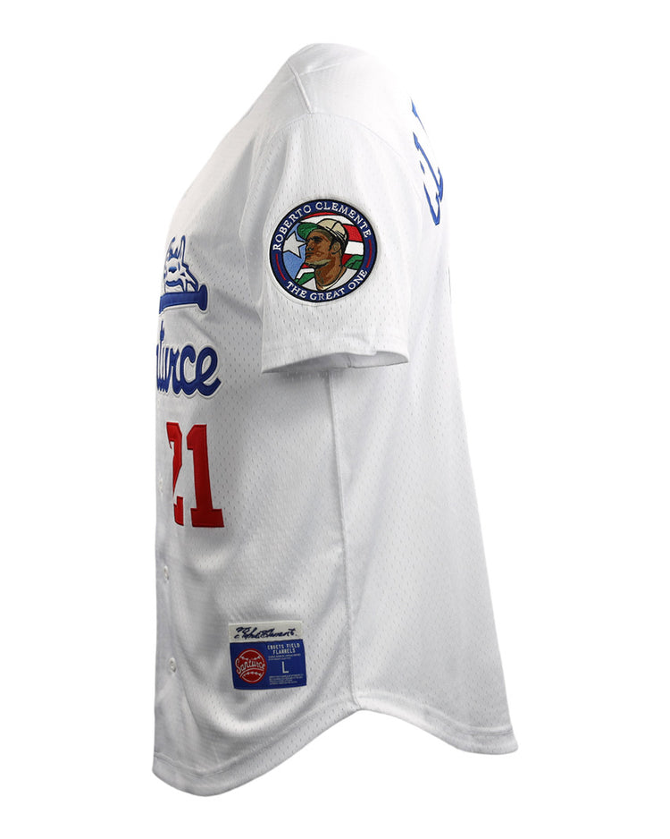 A side view of the EFF Roberto Clemente Santurce Cangrejeros Vintage Inspired NL Replica Button-Up Mesh Jersey, white with blue and red lettering, number 21, and a commemorative right sleeve patch, shown against a white background.