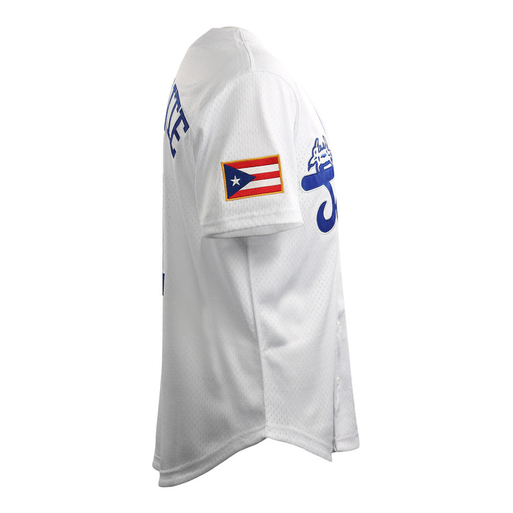 Side view of the Roberto Clemente Santurce Cangrejeros Vintage Inspired NL Replica Button-Up Mesh Jersey by EFF, featuring blue lettering and a Puerto Rican flag patch on the sleeve. Plain white background.