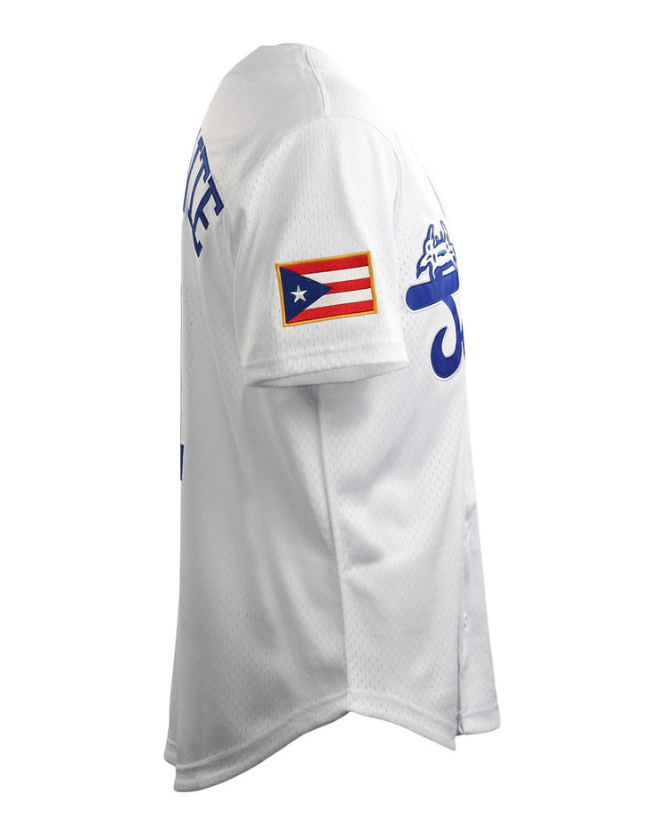 Side view of the Roberto Clemente Santurce Cangrejeros Vintage Inspired NL Replica Button-Up Mesh Jersey by EFF, featuring blue lettering and a Puerto Rican flag patch on the sleeve. Plain white background.