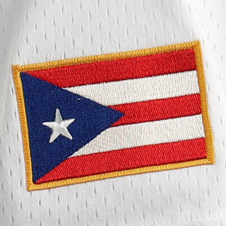 The image shows the flag of Puerto Rico, with red and white stripes, a blue triangle, a white star, and a gold border—details reminiscent of the EFF Roberto Clemente Santurce Cangrejeros Vintage Inspired NL Replica Button-Up Mesh Jersey.