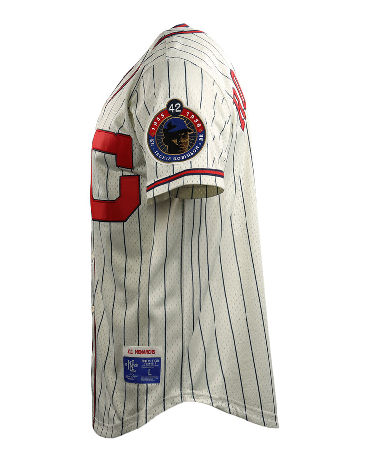 The EFF Jackie Robinson Kansas City Monarchs Vintage Inspired NL Replica Button-Up Mesh Jersey features white mesh with blue pinstripes, a red C, a #42 patch honoring Robinson, and a rectangular label on the hem.