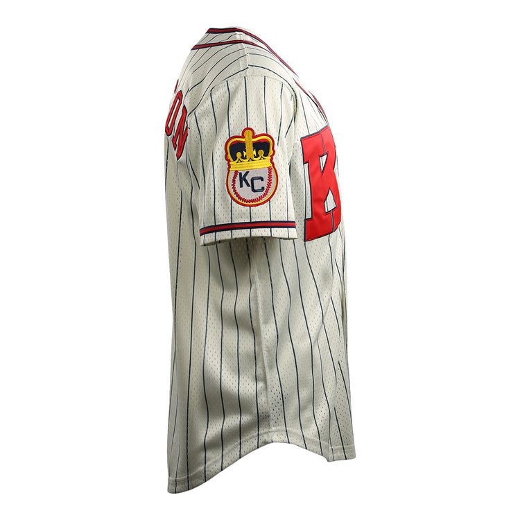 The EFF Jackie Robinson Kansas City Monarchs Vintage Inspired NL Replica Button-Up Mesh Jersey features white pinstripes, bold red front lettering, and a sleeve patch with a crown and KC.