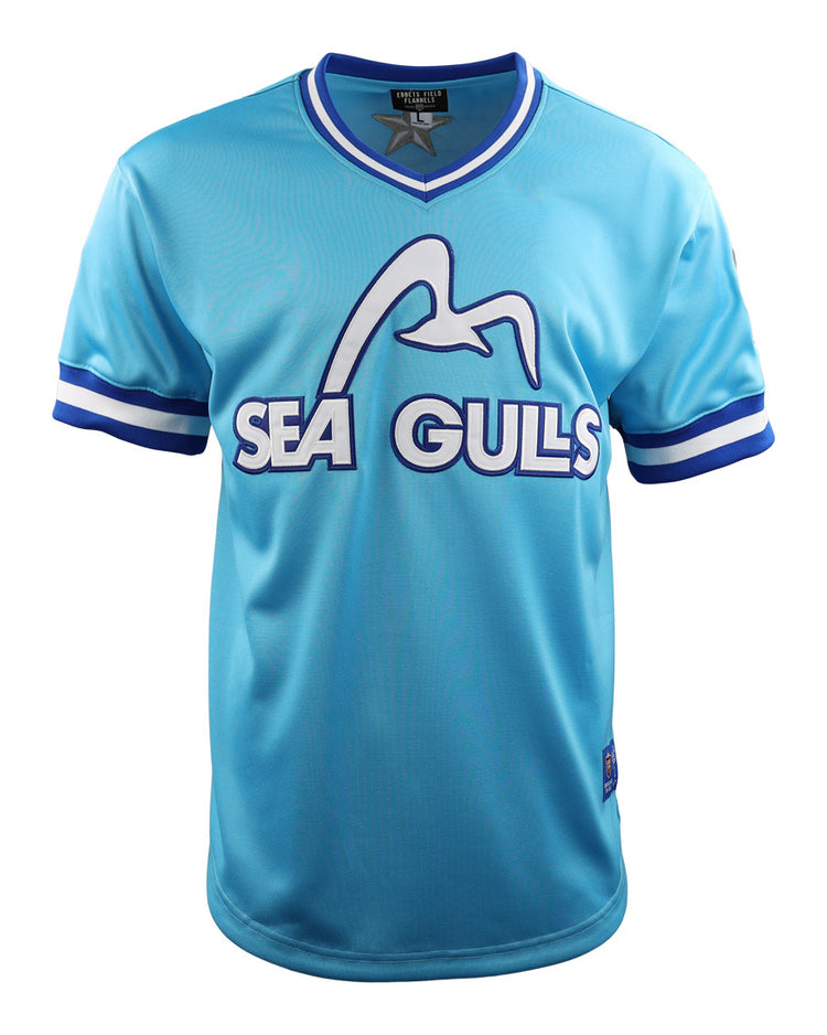 The EFF Corpus Christi Seagulls Lone Star Baseball Jersey features light blue fabric, white and blue striped sleeves, SEAGULLS text, and a seagull graphic—honoring the Gulf States League Champion Corpus Christi Seagulls.