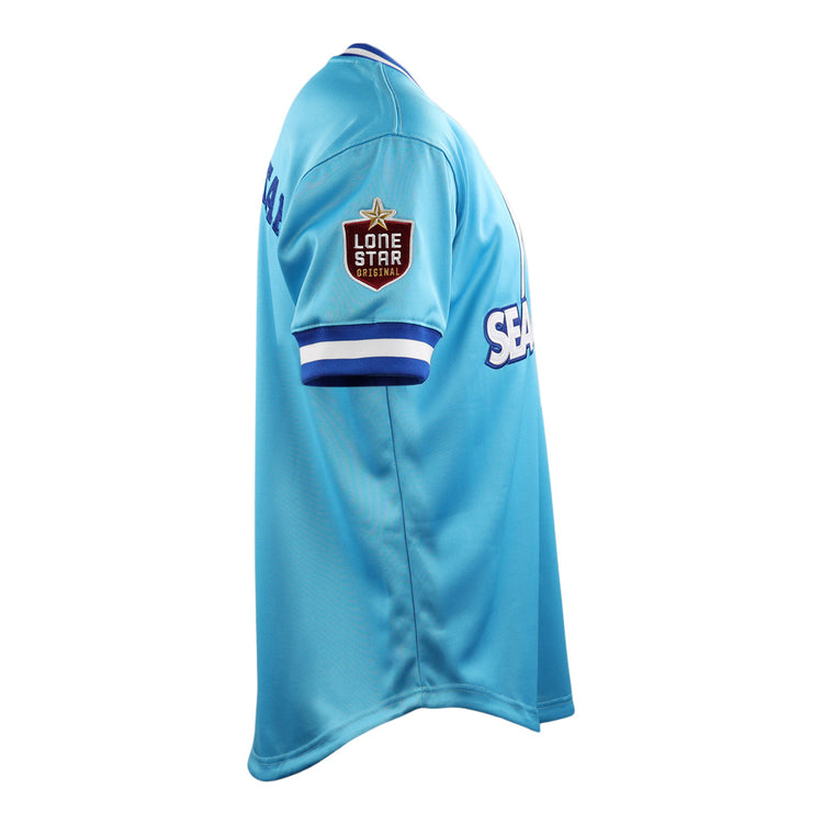 The EFF Corpus Christi Seagulls Lone Star Baseball Jersey features light blue fabric, white and blue striped cuffs, a Lone Star Originals patch on the sleeve, and SEA partially visible on the front.