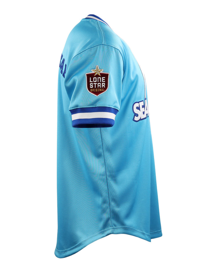 The EFF Corpus Christi Seagulls Lone Star Baseball Jersey features light blue fabric, white and blue striped cuffs, a Lone Star Originals patch on the sleeve, and SEA partially visible on the front.