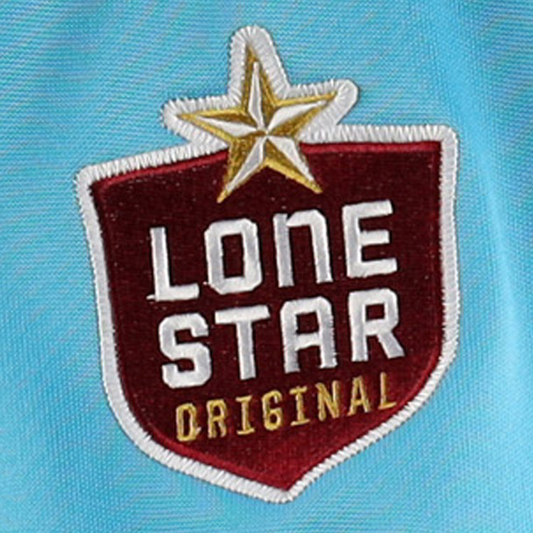The EFF Corpus Christi Seagulls Lone Star Baseball Jersey features a red shield patch with a gold star, white LONE STAR text, and yellow ORIGINAL, all set on light blue fabric to honor the Lone Star League team.