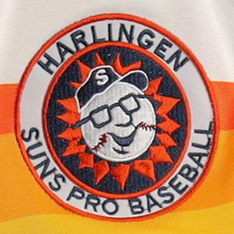 The Harlingen Suns EFF Lone Star Baseball Jersey by EFF features an embroidered patch logo with a smiling baseball in glasses and cap inside an orange sunburst, plus Texas baseball text around the border.