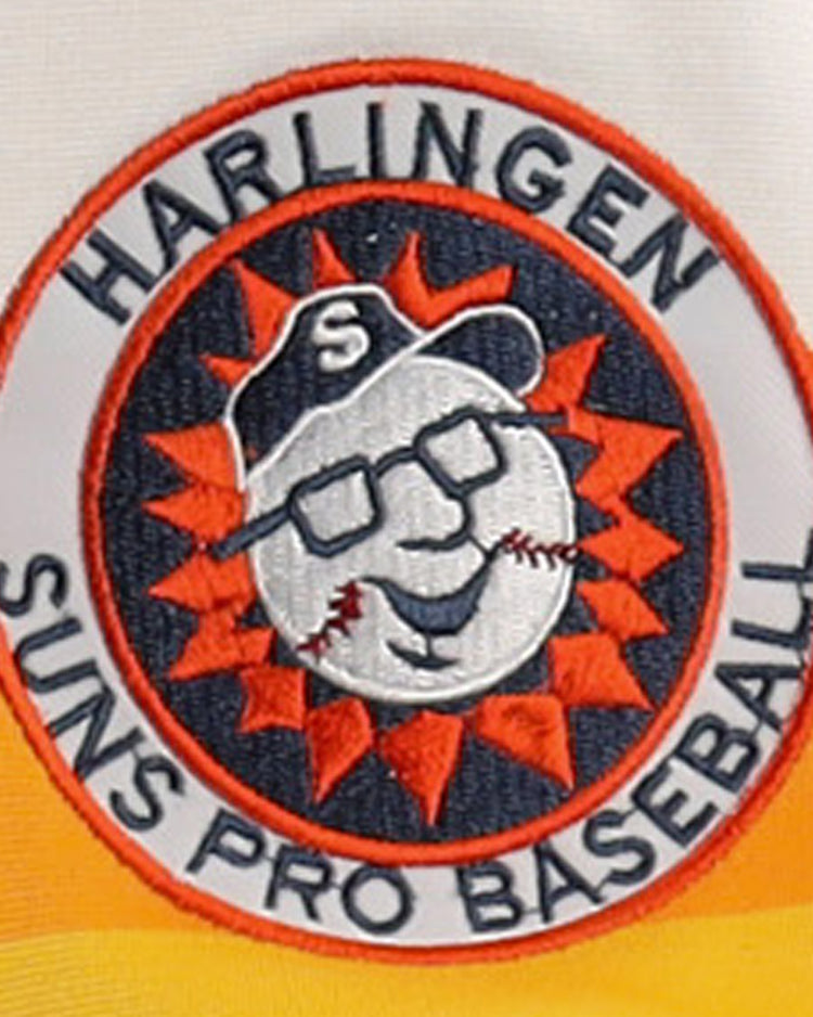 The Harlingen Suns EFF Lone Star Baseball Jersey by EFF features an embroidered patch logo with a smiling baseball in glasses and cap inside an orange sunburst, plus Texas baseball text around the border.