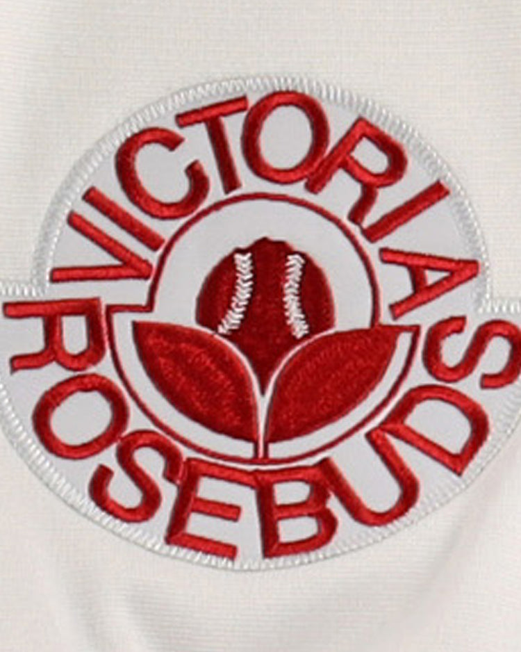 A white embroidered patch with red text Victoria Rosebuds encircles a red rosebud on the EFF Lone Star Baseball Jersey—a perfect keepsake for North Division and Lone Star League fans.