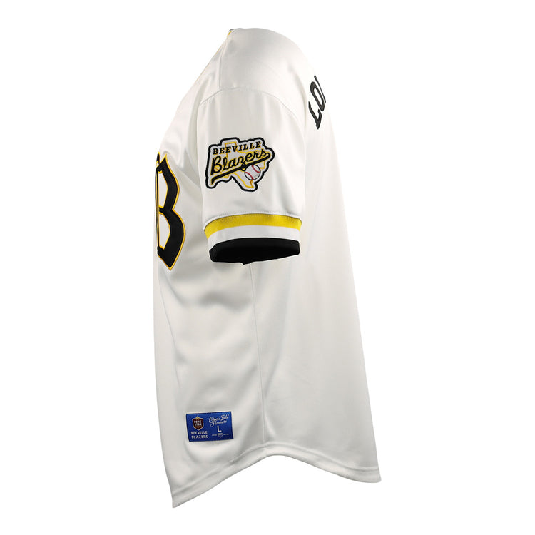 Side view of the EFF Beeville Blazers EFF Lone Star Baseball Jersey in white with black and yellow trim, featuring a Beeville Blazers patch on the sleeve, LOUD lettering on the upper arm, and a partially visible black front number.