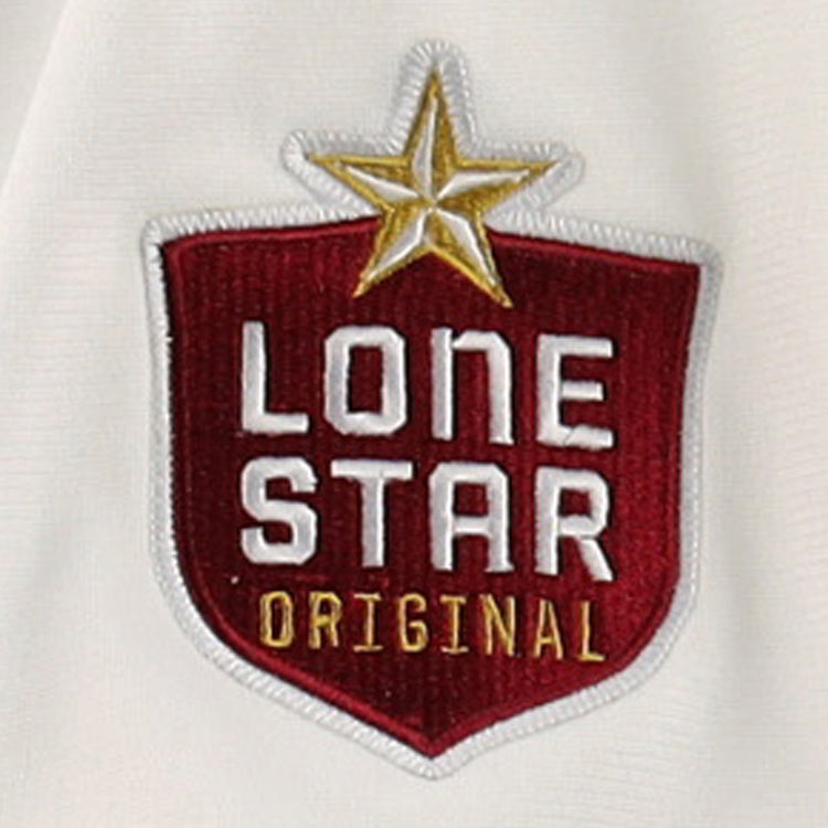 A red, shield-shaped patch with LONE STAR ORIGINAL in white and gold, topped by a gold star, decorates the EFF Beeville Blazers Lone Star Baseball Jersey—great for fans of Corpus Christi or the Blazers.