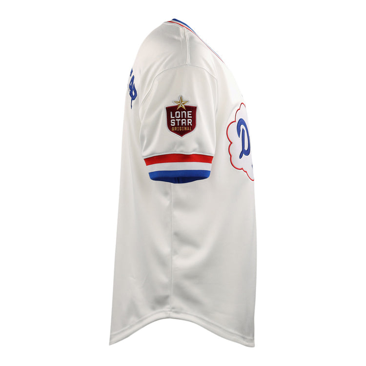 Side view of the McAllen Dusters EFF Lone Star Baseball Jersey by EFF in white, featuring red and blue trim, a Lone Star patch on the sleeve, and a partial blue script logo on the chest.