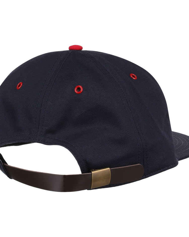 The EFF Columbus Red Birds Cotton Twill Ballcap is a navy blue cotton twill cap with red eyelets, a red top button, and an adjustable strap with a brass-colored clasp, seen from the back. Ideal for fans of classic cotton ballcaps.