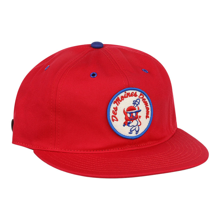 The EFF Des Moines Demons Cotton Twill Ballcap features a bright red design, round demons patch with cartoon graphic and Des Moines Demons text, plus blue eyelet and button accents—perfect for any summer series game.