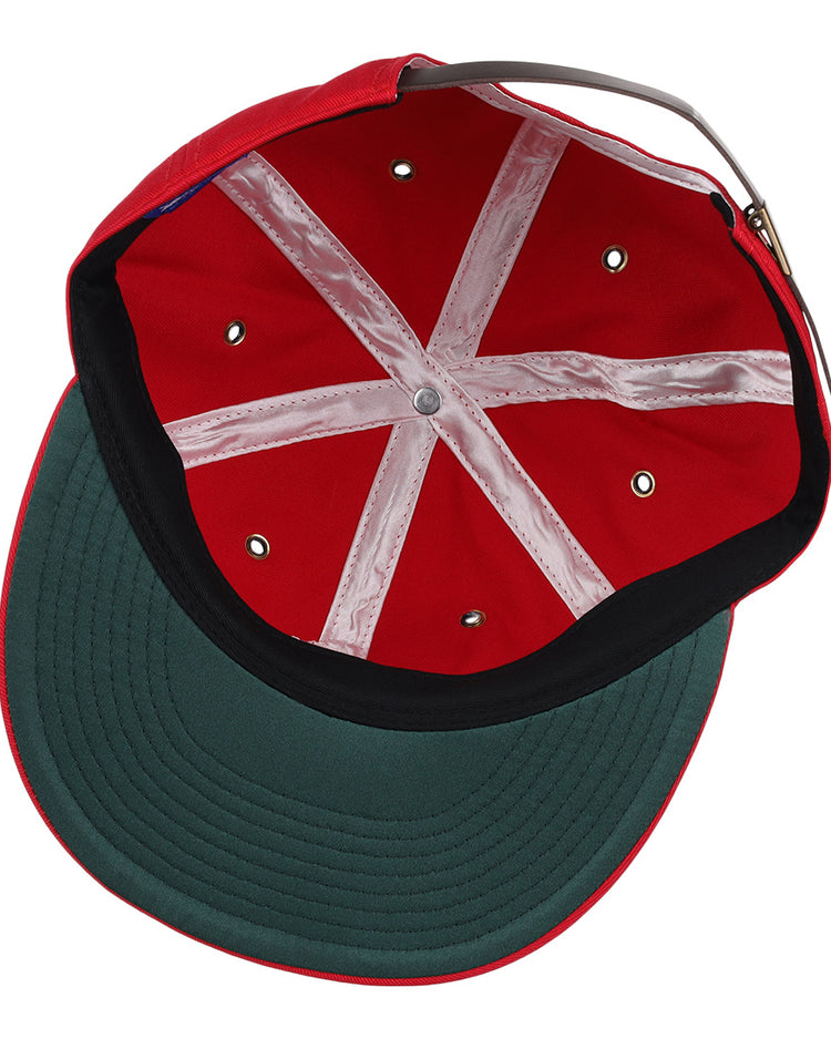 Inside view of the EFF Havana Sugar Kings Cotton Twill Ballcap: red cotton, Cuban League-inspired, white crisscross bands, metal rivets, green underbill, and adjustable back strap.