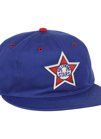 The EFF Hollywood Stars Cotton Twill Ballcap features blue cotton, a red button and eyelets, and a white star patch on the front reading ARLINGTON STARS with a central blue star—evoking classic Pacific Coast League style.