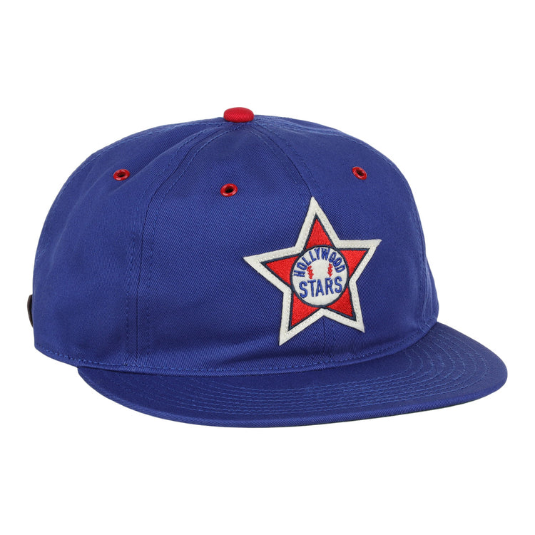 The EFF Hollywood Stars Cotton Twill Ballcap features blue cotton, a red button and eyelets, and a white star patch on the front reading ARLINGTON STARS with a central blue star—evoking classic Pacific Coast League style.