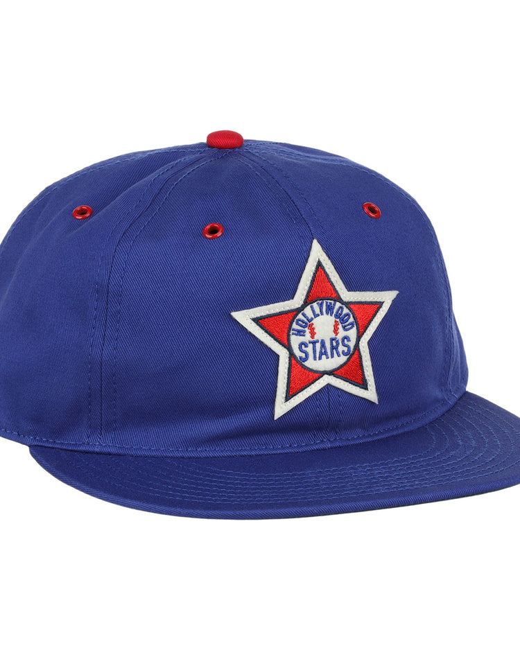 The EFF Hollywood Stars Cotton Twill Ballcap features blue cotton, a red button and eyelets, and a white star patch on the front reading ARLINGTON STARS with a central blue star—evoking classic Pacific Coast League style.