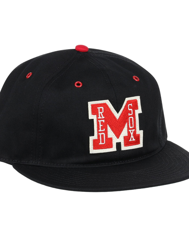 The EFF Memphis Red Sox Cotton Twill Ballcap is a black cap with a red button and eyelets, featuring a bold red M and Red Sox in white—honoring the legendary Negro American League team.