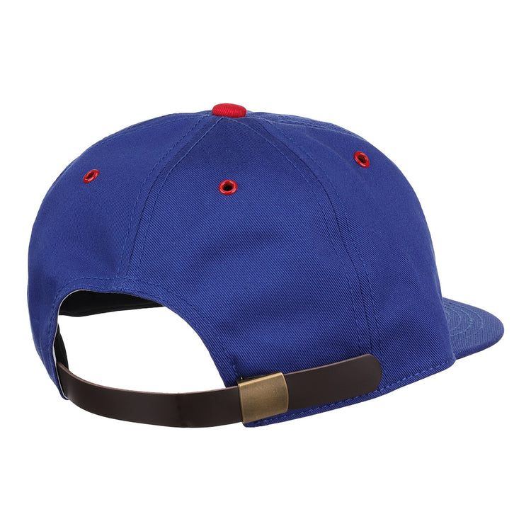 The EFF Reddy Kilowatt Cotton Twill Ballcap in blue features a brown adjustable strap with brass buckle, red accents on the vents and top button, and is part of the summer series inspired by Reddy Kilowatt.