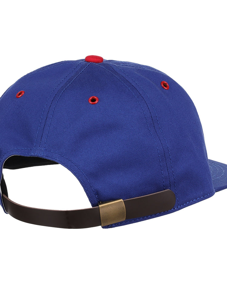 The EFF Reddy Kilowatt Cotton Twill Ballcap in blue features a brown adjustable strap with brass buckle, red accents on the vents and top button, and is part of the summer series inspired by Reddy Kilowatt.