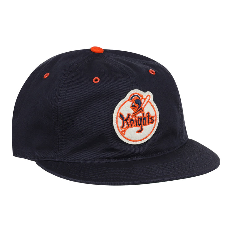 The EFF New York Knights Cotton Twill Ballcap features a black cotton build, orange button and eyelets, and a front patch with a knight holding a sword and Knights in orange, inspired by The Naturals New York Knights.