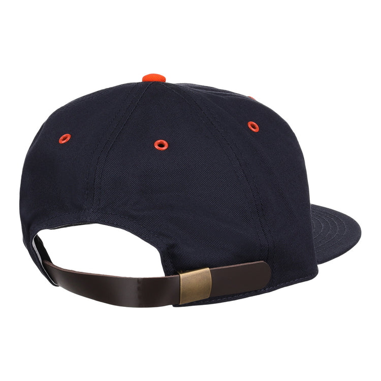 The EFF New York Knights Cotton Twill Ballcap features navy blue cotton, orange eyelets and top button, plus an adjustable brown leather strap with brass buckle—classic style inspired by The Natural.