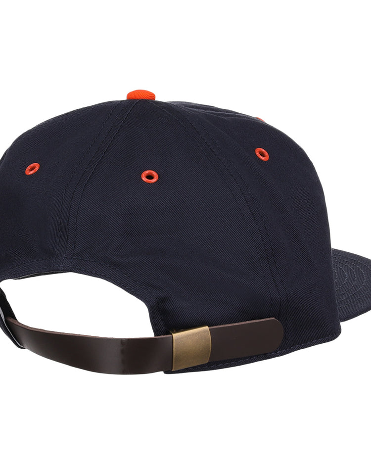 The EFF New York Knights Cotton Twill Ballcap features navy blue cotton, orange eyelets and top button, plus an adjustable brown leather strap with brass buckle—classic style inspired by The Natural.
