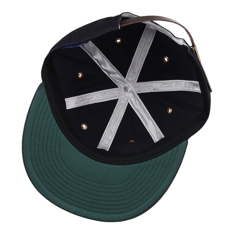 An inside look at the EFF New York Knights Cotton Twill Ballcap shows the green underbrim, black interior panels, silver cross-shaped stitching, ventilation eyelets, and an adjustable back strap—tribute to The Natural.