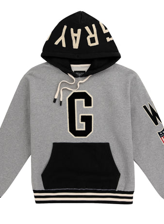 The EFF Homestead Grays Vintage Inspired NLB Colorblock Hoodie features a bold black G front, GRAYS on the hood, striped cuffs/hem, and a USA flag patch—honoring Pittsburgh’s baseball heritage in style.