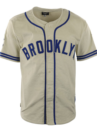 The EFF Brooklyn Royal Giants Vintage Inspired NLB Corduroy Jersey is beige with blue stripes, BROOKLYN in bold blue letters, a button-down front, and rounded neckline—honoring the Negro National League’s Royal Giants.