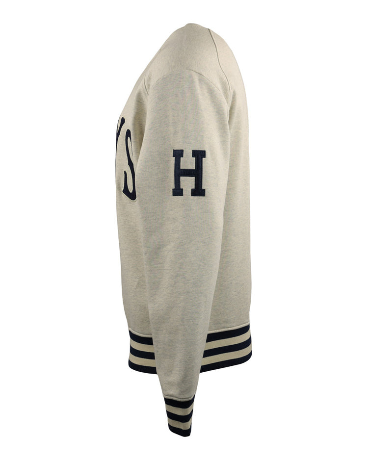 Side view of the EFF Homestead Grays NLB Corduroy Crewneck in light gray, featuring navy stripes on the cuffs and hem, an H on the sleeve, and partial navy lettering honoring Black Baseball teams on the chest.