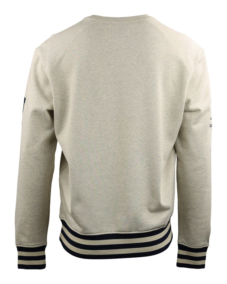 The EFF Homestead Grays NLB Corduroy Crewneck is shown from the back in beige, with black and white striped cuffs and waistband. Its simple design subtly honors Negro National League Black Baseball teams, featuring no visible logos or graphics.