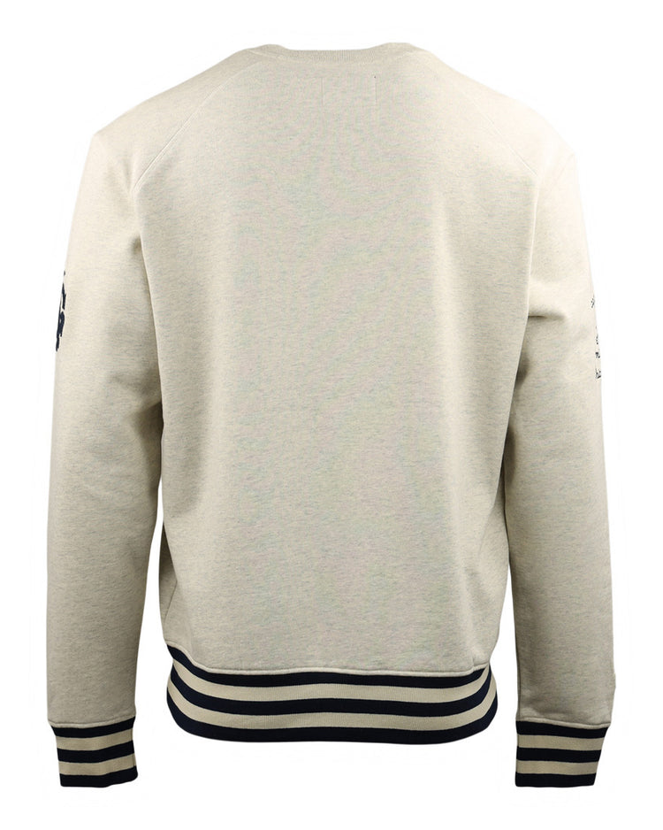 Back view of the EFF Chicago American Giants NLB Corduroy Crewneck in cream, featuring black and white striped cuffs and waistband. This long-sleeve sweatshirt honors historic Black baseball teams with its minimal detailing.