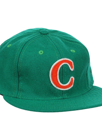 The Carrots Arlington Heights Collection “C Ballcap by Ebbets Field Flannels is a green, vintage-style wool cap with a curved brim and an orange and white embroidered “C” on the front.