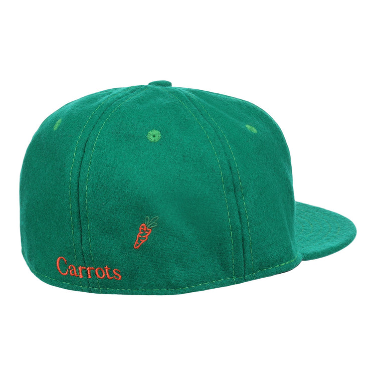 The Carrots Arlington Heights Collection “C Ballcap by Ebbets Field Flannels is a green suede baseball cap, shown from the back with orange Carrots embroidery and a small carrot graphic.