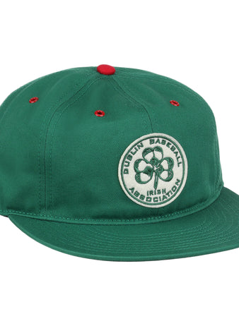 The EFF Dublin Irish Cotton Twill Ballcap is a green hat with red eyelets and a red top button, featuring a circular four-leaf clover patch and Dublin Baseball Irish Association on the front for classic Irish style.